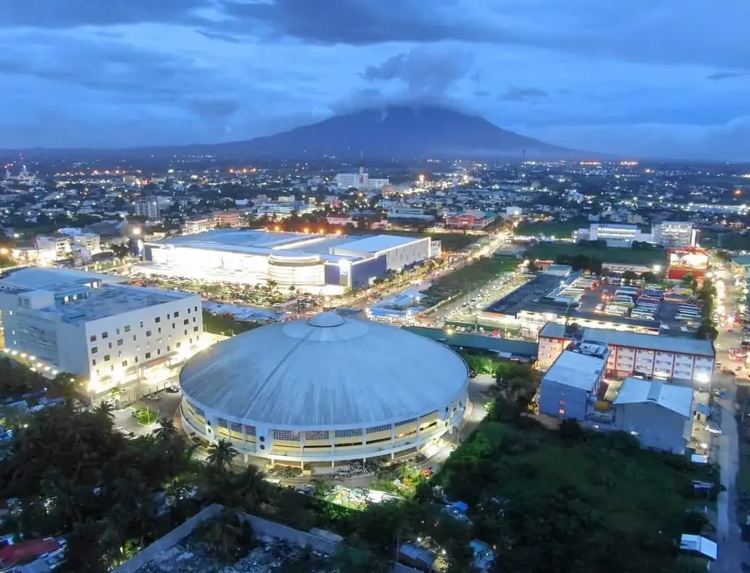 Legazpi at dusk with Mount Mayon on the horizon